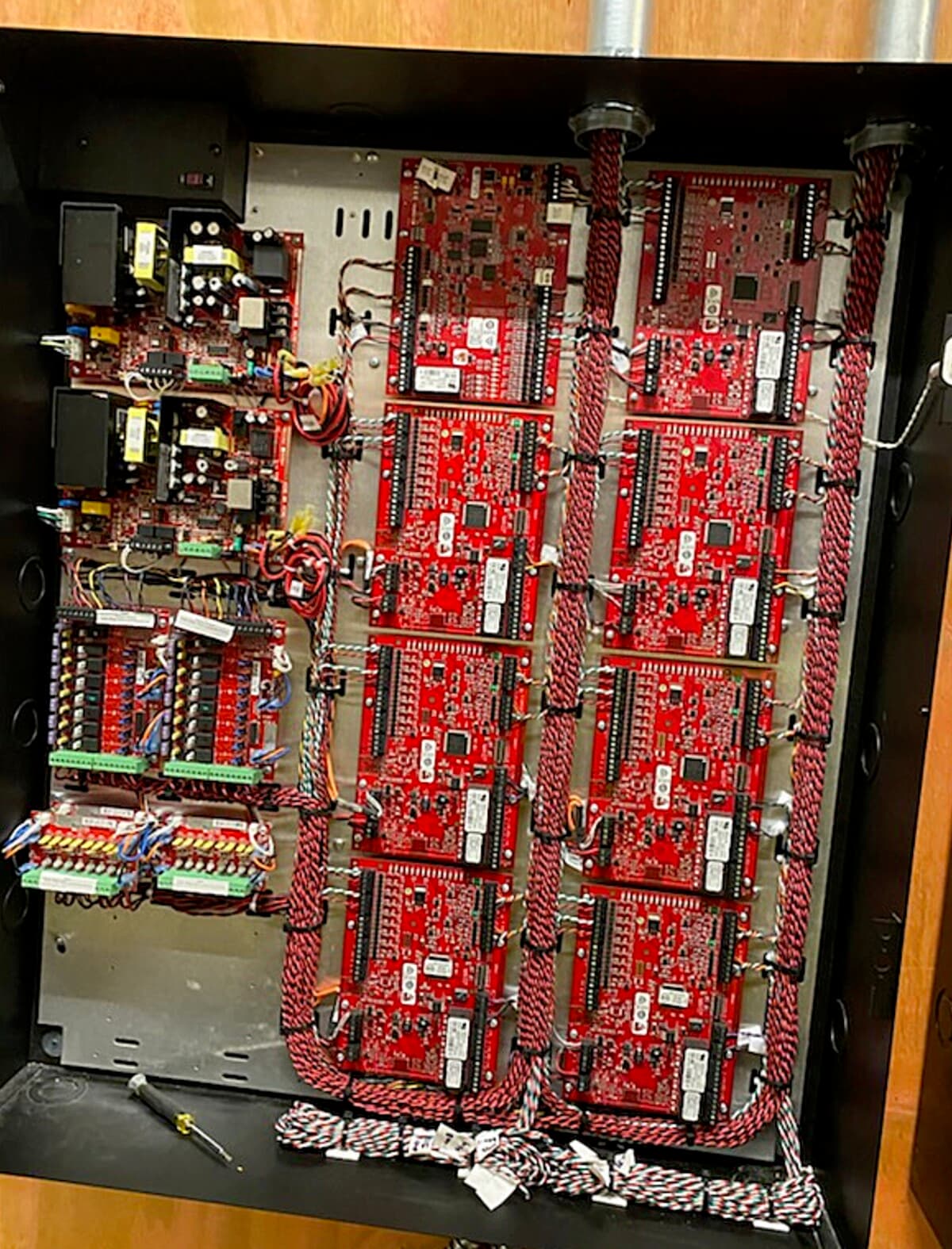 Bank of Vicon access control boards wired and labeled inside the enclosure