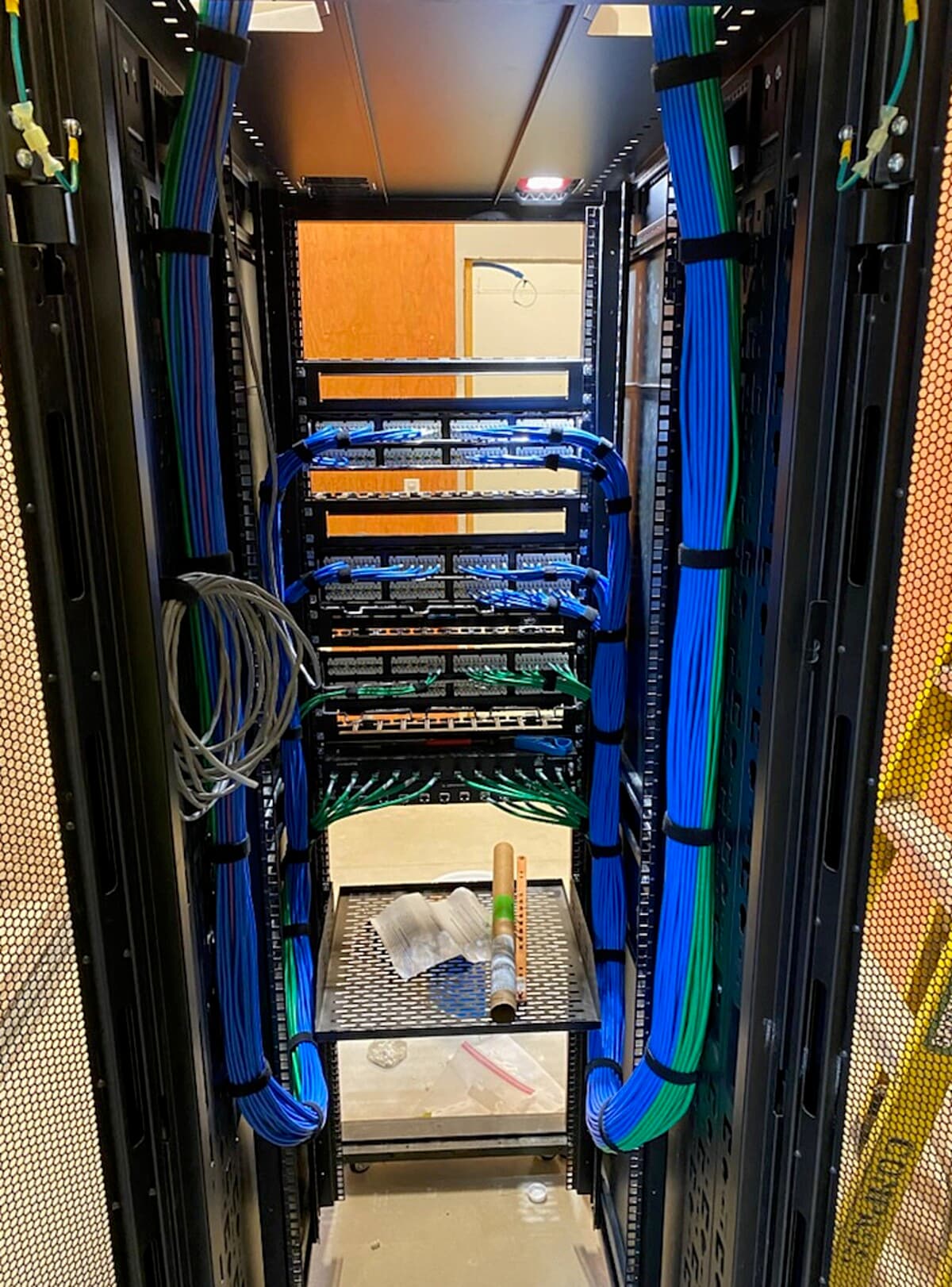 Server rack with dressed structured cabling and labeled patch panels